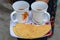 Tea with papad, woman serving indian tea