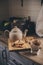 Tea pot and cookies in rustic grey kitchen interior. Slow living in country house concept