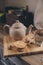 Tea pot and cookies in rustic grey kitchen interior. Slow living in country house concept