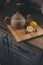 Tea pot and lemons in rustic grey kitchen interior. Slow living in country house concept