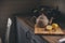 Tea pot and lemons in rustic grey kitchen interior. Slow living in country house concept