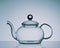 Tea Pot on Reflective Surface