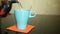 Tea is poured into a blue ceramic glass