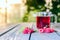 Tea with ripe raspberries and green fresh brewed leaves healthy for health on a wooden table