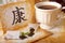 Tea scattered, Chinese health symbol and tea cup