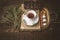 Tea set with blurred herb and chocolate on the wooden table horizontal