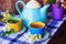 Tea set on the dark blue tablecloth