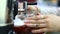 Tea sommelier pours boiling water into the kettle