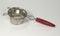 Tea strainer with red wood handle