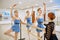 Teacher and ballerinas, exercise at barre in class