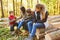 Teacher and children group in the forest at the tree study