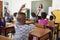 Teacher and elementary school class, foreground in focus