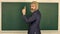 Teacher explain topic. Man teacher in front of chalkboard copy space. Announcement of free courses. Advertisement