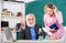 Teacher and girl with notepad near chalkboard. Biology science. Biologist or chemist with microscope teaching student