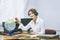 Teacher happy young woman in a classroom with electronic tablet