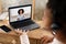 Teacher Having Class With Schoolgirl Learning At Laptop At Home