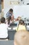 Teacher holding a dummy skeleton while a schoolgirl touching his lungs