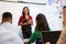 Teacher listening to students at an adult education class