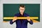 Teacher man at chalkboard holding ruler, math subject concept