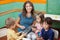 Teacher Playing Xylophone With Students In