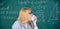 Teacher ready to eat her paperwork. Woman teacher eats crumpled piece of paper chalkboard background. Thirst of