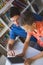 Teacher and school kid using digital table in library