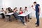 Teacher shouting through megaphone on university students