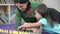 Teacher Showing Girl How To Count With Plastic Toys