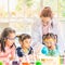 Teacher and students in lab, smoke float out