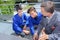 Teacher with students outside on metal platform