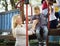 Teacher taking care of kindergarten girl at playground