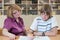 Teacher teaches a pupil at a table in the classroom