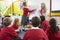 Teacher Teaching Maths To Elementary School Pupils