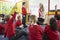 Teacher Teaching Maths To Elementary School Pupils