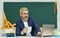 Teacher teaching programming language. Teacher at classroom. Watch video for step by step tutorial. Handsome man use