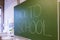 Teacher Writing on Green Chalkboard Professor University White C