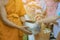 Teachers and students together make merit to give food offerings to a Buddhist monk on important religious days