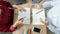 Teaching helping technology concept. Woman young teacher or tutor with adult students in classroom at desk with papers, laptop