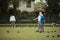 Teaching Senior Friend How to Lawn Bowl