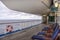 Teak lined Promenade Deck of modern cruise ship on a grey stormy day