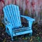 Teal Adirondack Chair - Red Weathered Background