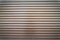 Teal brown painted horizontal metal window roller shutter blinds or garage doors background texture