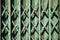 Teal color old rusty folding gate background