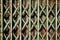 Teal color old rusty folding gate background