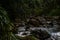 Teal colored stream deep in mountains