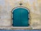 Teal Door Against a Stone Wall