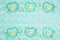 Teal frame hearts, teddy bears and rose buds on pale teal plush fabric background