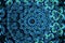 Teal mandala smooth spread of ink explosion, kaleidoscopic background. Beautiful multicolor kaleidoscope texture. Movement
