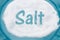Teal Plate with a lot of salt with text Salt