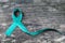 Teal ribbon awareness isolated with clipping path for Ovarian Cancer, Polycystic Ovarian Syndrome PCOS disease, Post Traumatic